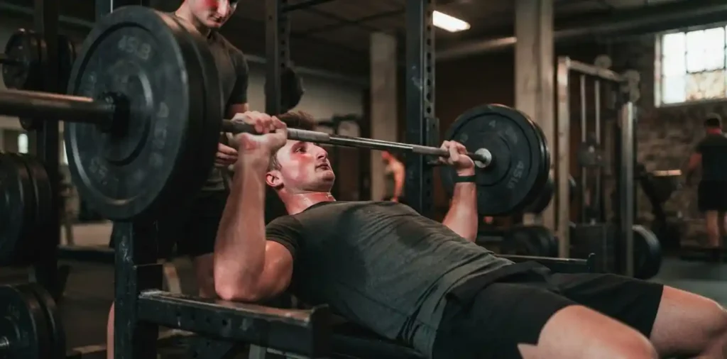 Man pushing through intense chest workout
